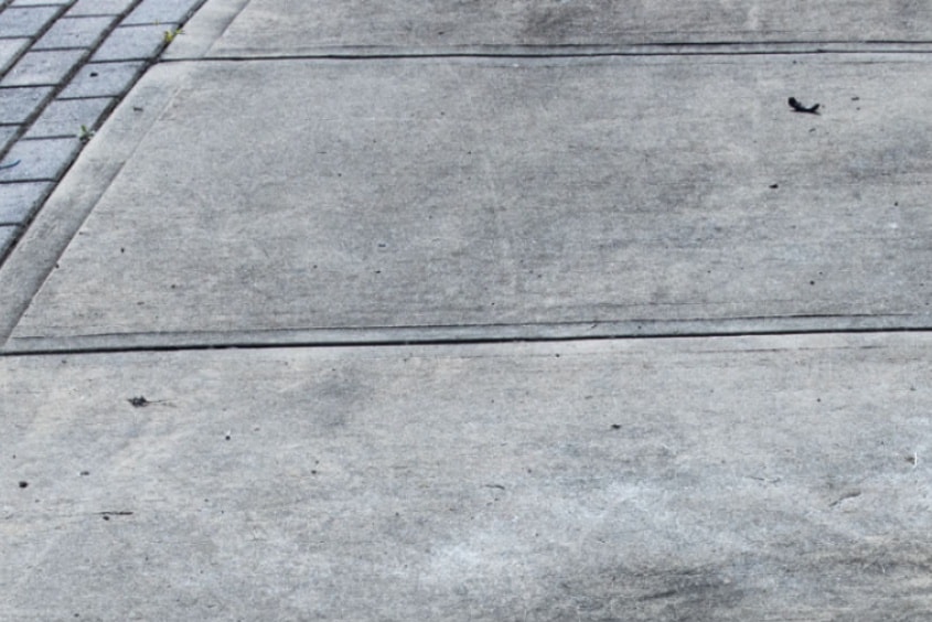 Before pressure washing — dirty stained surface